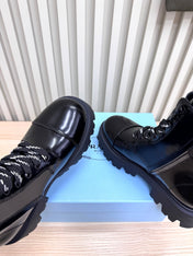 PRADA 25S MONOLITH BOOTS IN BLACK GLOSSY CALFSKIN