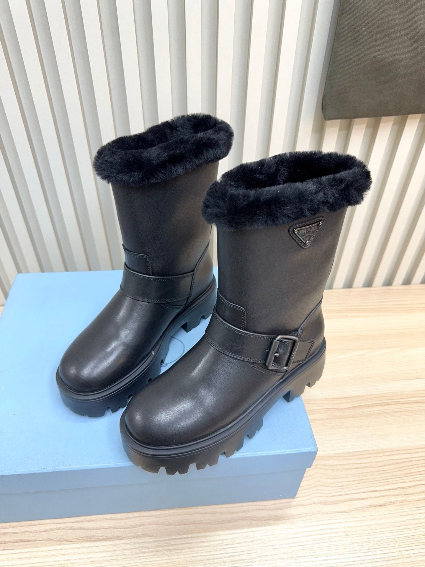 PRADA 25S MARTIN BOOTS IN BLACK CALFSKIN FUR-LINED
