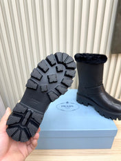 PRADA 25S MARTIN BOOTS IN BLACK CALFSKIN FUR-LINED