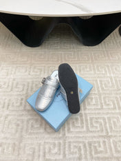 TASSEL MULES IN SILVER METALLIC LAMBSKIN