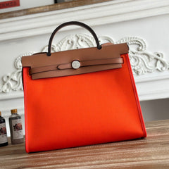 ZIP CABINE 31 BAG IN FIRE ORANGE CANVAS AND BRONZE BROWN CALFSKIN
