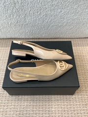 FLAT MULES IN BISQUE BEIGE PATENT CALFSKIN