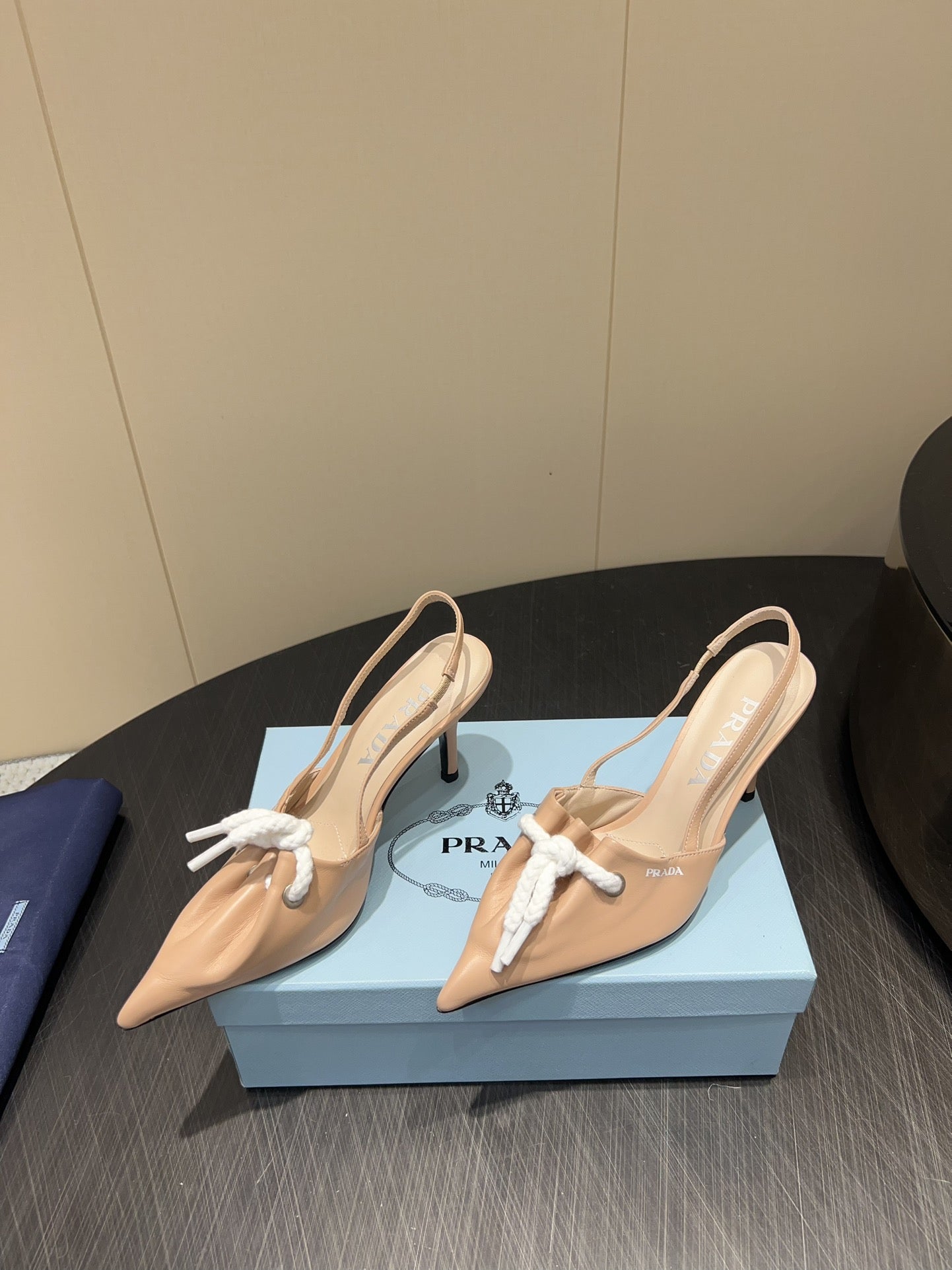 PRADA 25S POINTED TOE SLINGBACK 85MM IN BEIGE LAMBSKIN WITH TIE UP DESIGN