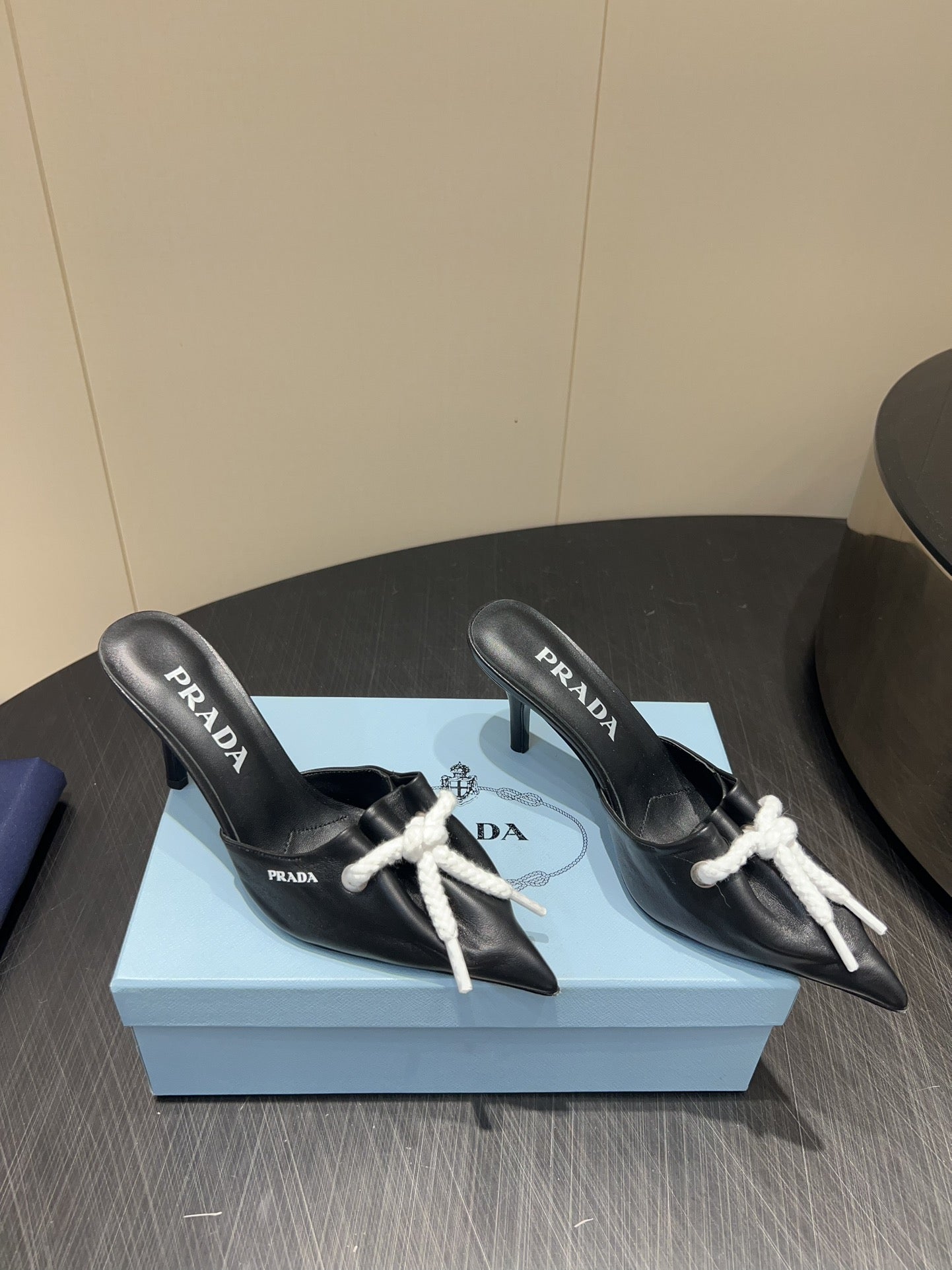 PRADA 25S BRAIDED DETAIL MULES 85MM IN BLACK CALFSKIN