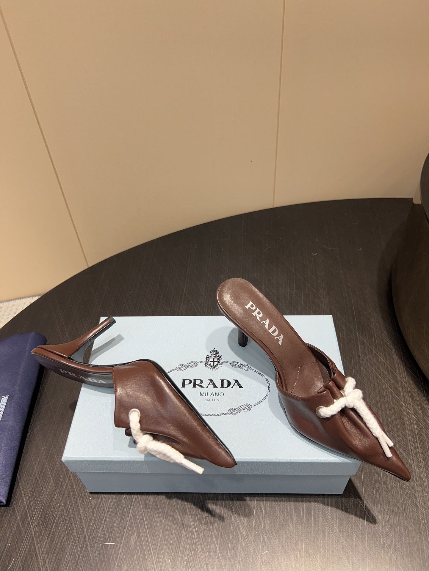 PRADA 25S BRAIDED DETAIL MULES 85MM IN DARK BROWN CALFSKIN