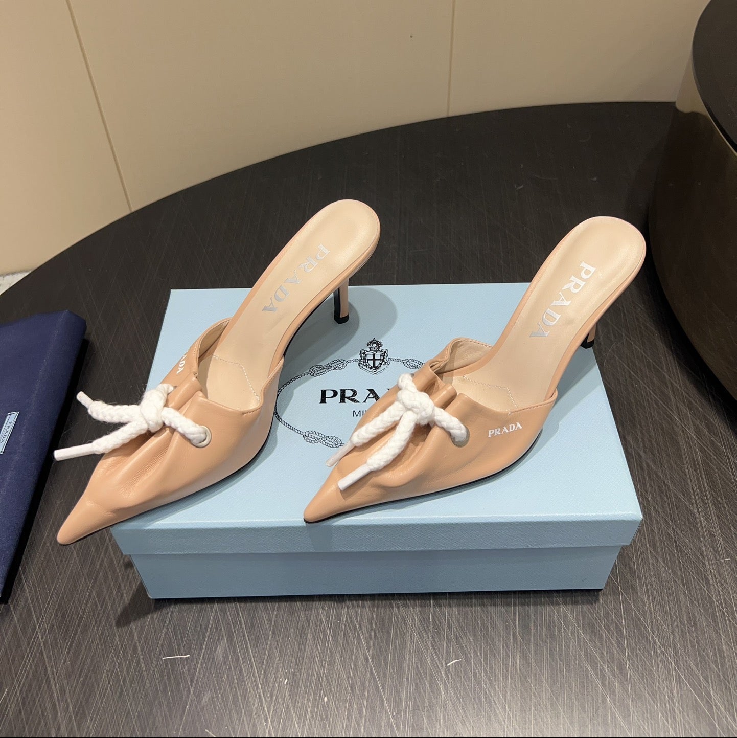 PRADA 25S BRAIDED DETAIL MULES 85MM IN BEIGE CALFSKIN