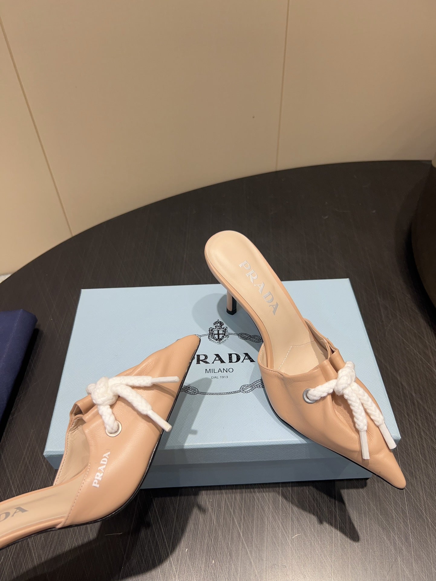 PRADA 25S BRAIDED DETAIL MULES 85MM IN BEIGE CALFSKIN