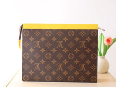 LV 25S POCHETTE VOYAGE 26 IN YELLOW MONOGRAM MACASSAR COATED CANVAS