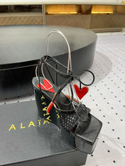 ALAIA BANQUET WEDGE SANDALS IN BLACK LAMBSKIN WITH RED HEART