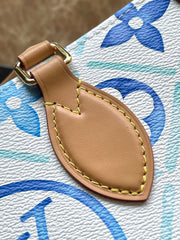 ONTHEGO EAST WEST 25 IN LAGOON BLUE MONOGRAM TILES CANVAS