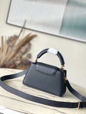 CAPUCINES EAST-WEST MINI 22 IN BLACK CALFSKIN GOLD HARDWARE