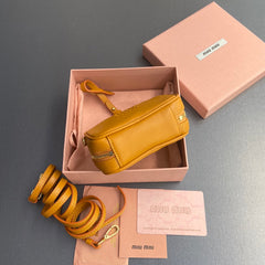 MICRO BAG KEYCHAIN 11  IN INDOCHINE ORANGE CALFSKIN EMBOSSED LOGO