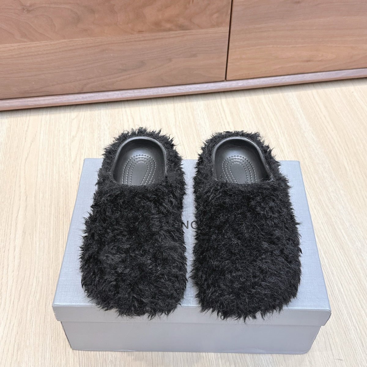 BALENCIAGA 25S MULES IN BLACK FAUX FUR