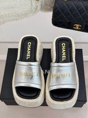 PLATFORM SLIPPERS IN SILVER LAMBSKIN