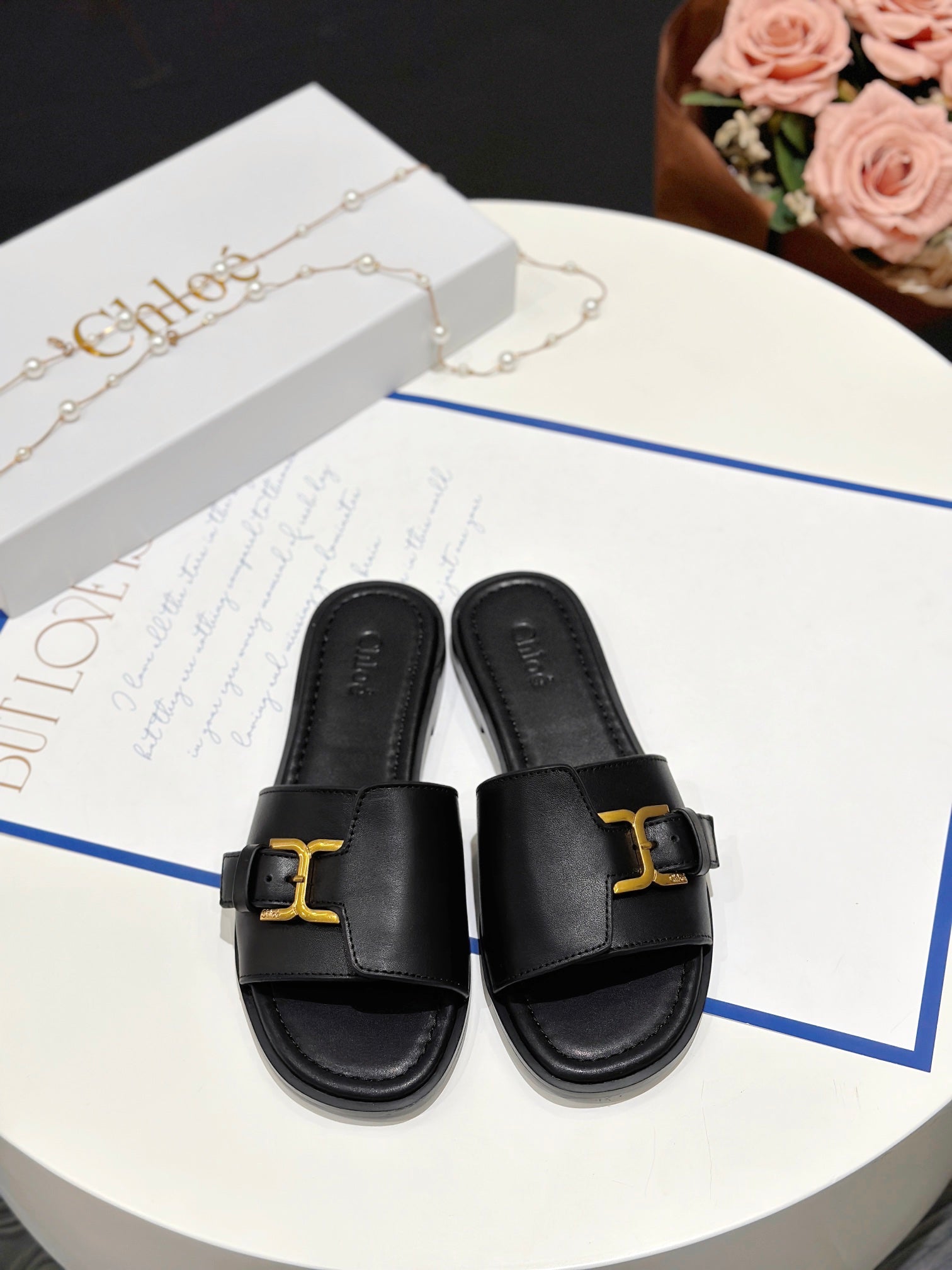 MARCIE SLIDE IN BLACK CALFSKIN WITH GOLD HARDWARE