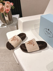 PRADA 25S FLAT MULES IN CREAM AND DARK BROWN RABBIT FUR