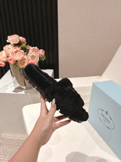 PRADA 25S FLAT MULES IN BLACK RABBIT FUR