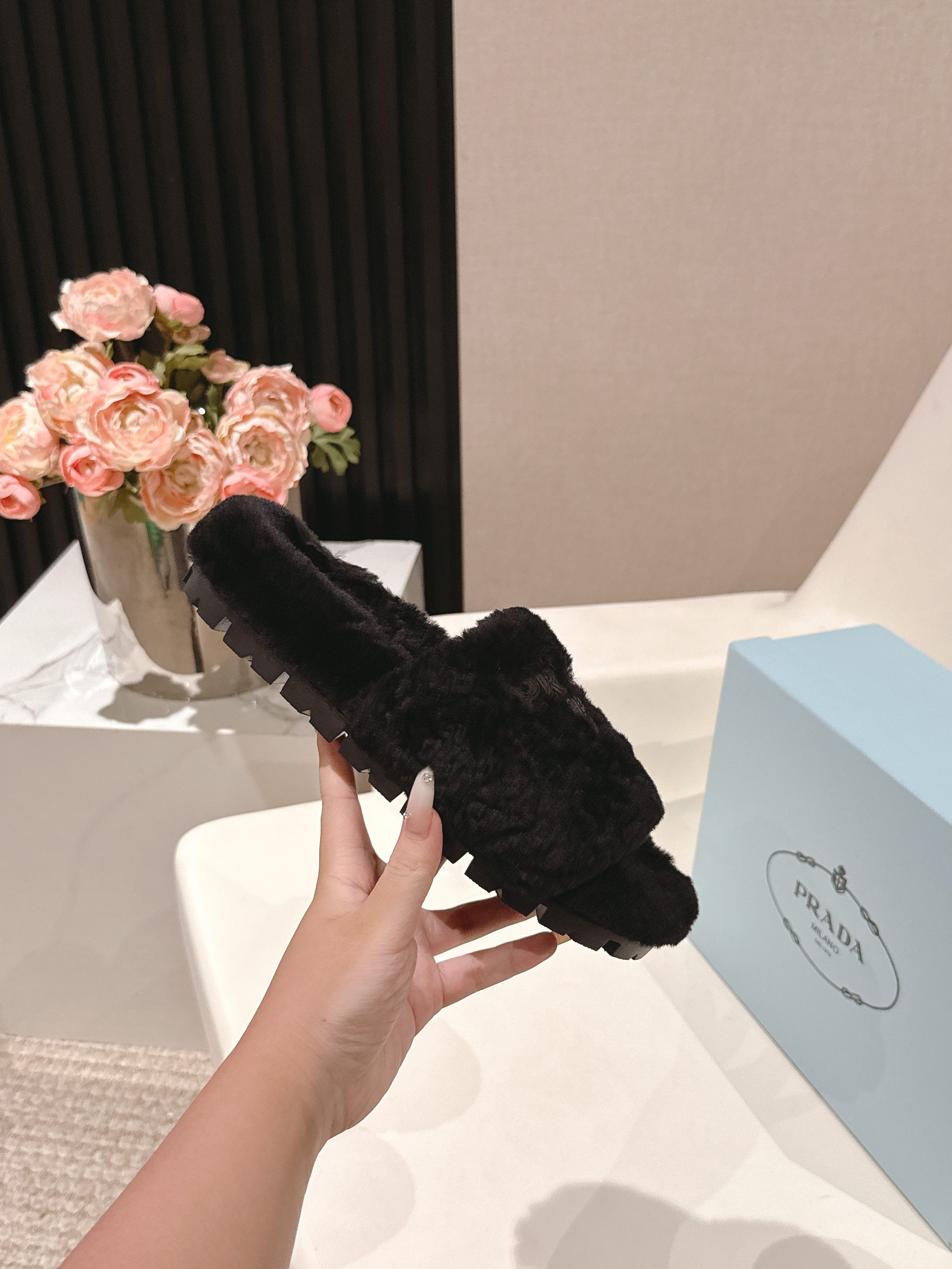 PRADA 25S FLAT MULES IN BLACK RABBIT FUR