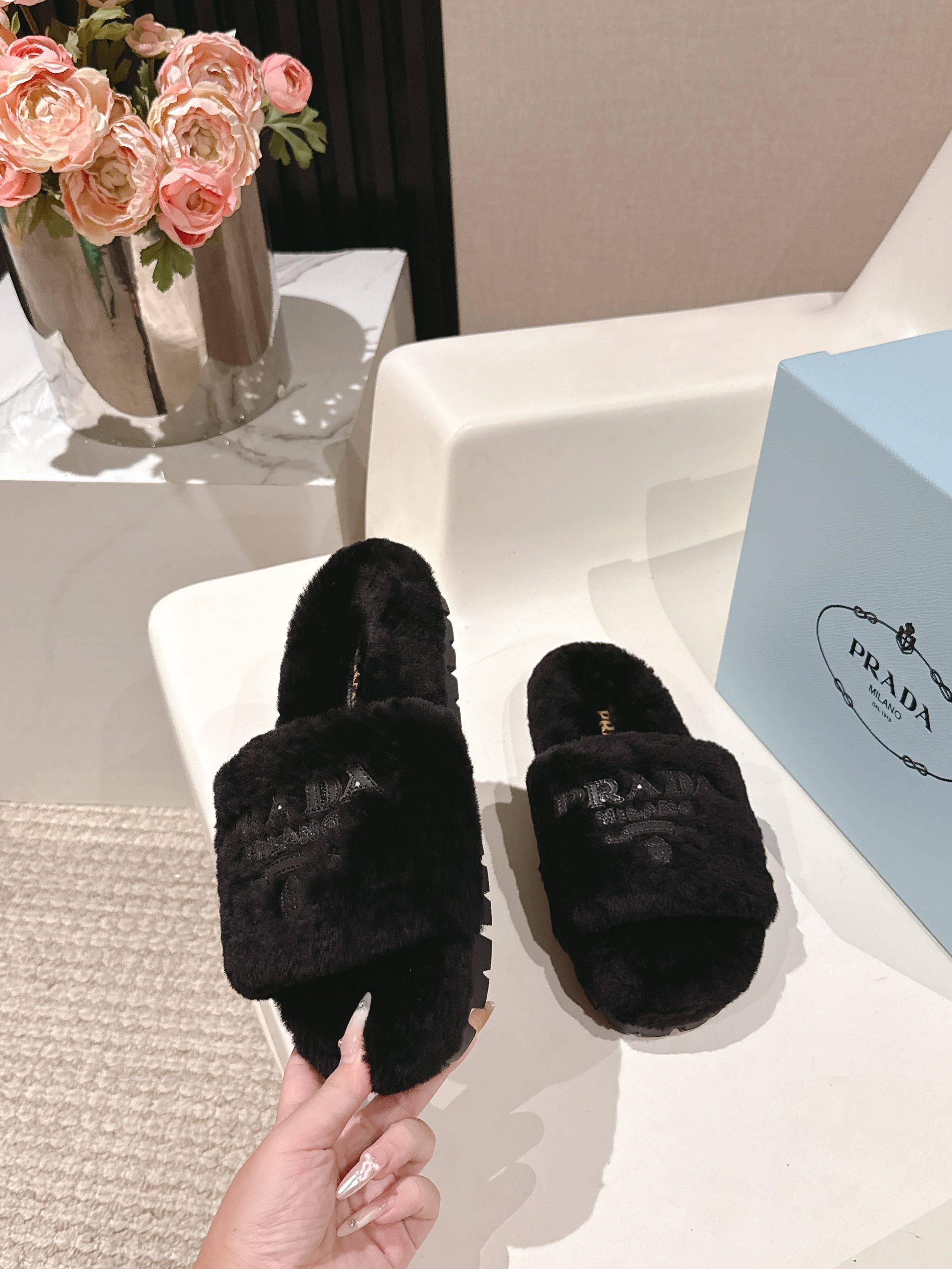 PRADA 25S FLAT MULES IN BLACK RABBIT FUR