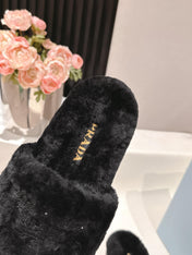 PRADA 25S FLAT MULES IN BLACK RABBIT FUR