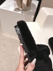 PRADA 25S FLAT MULES IN BLACK RABBIT FUR