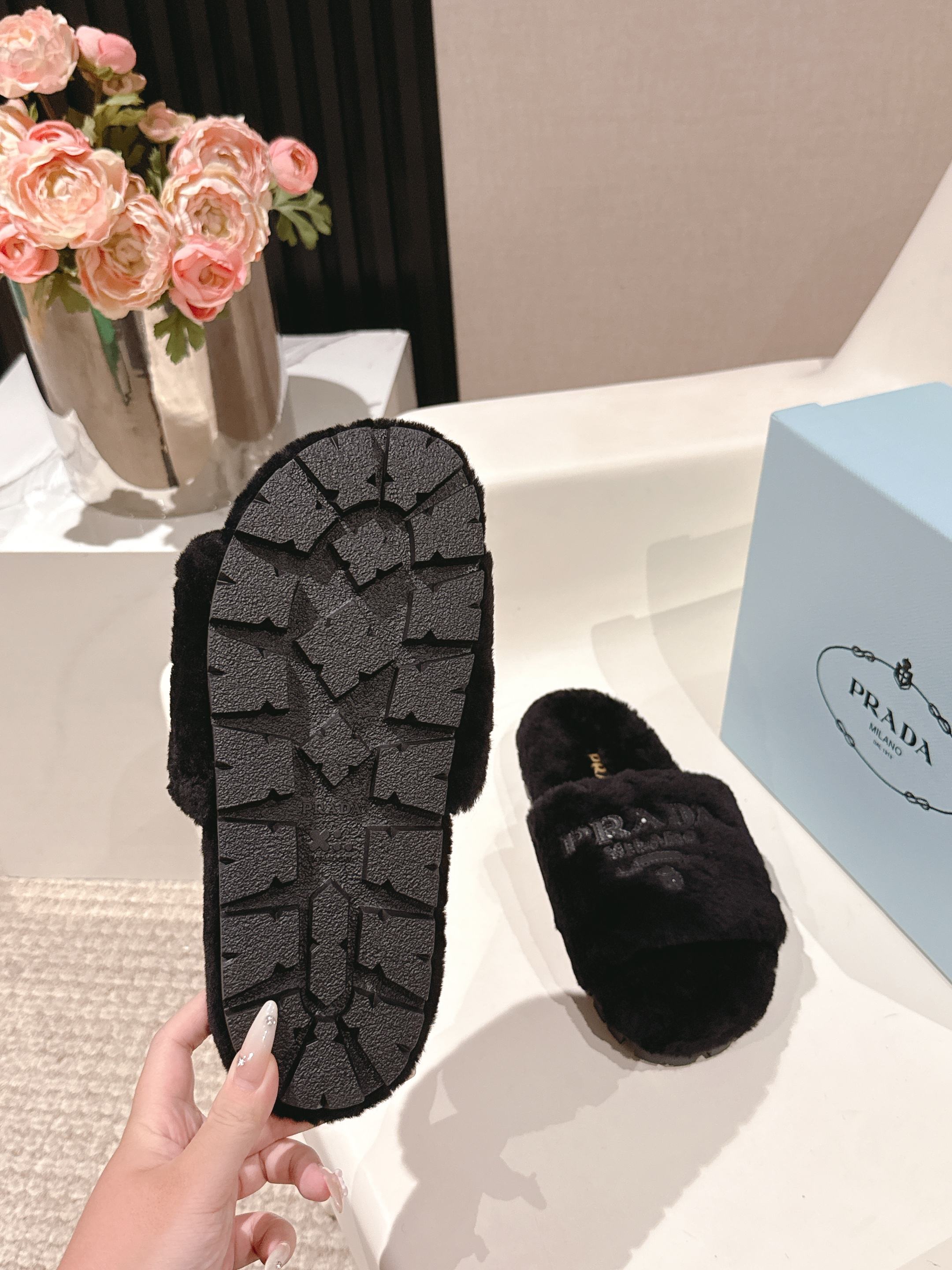 PRADA 25S FLAT MULES IN BLACK RABBIT FUR