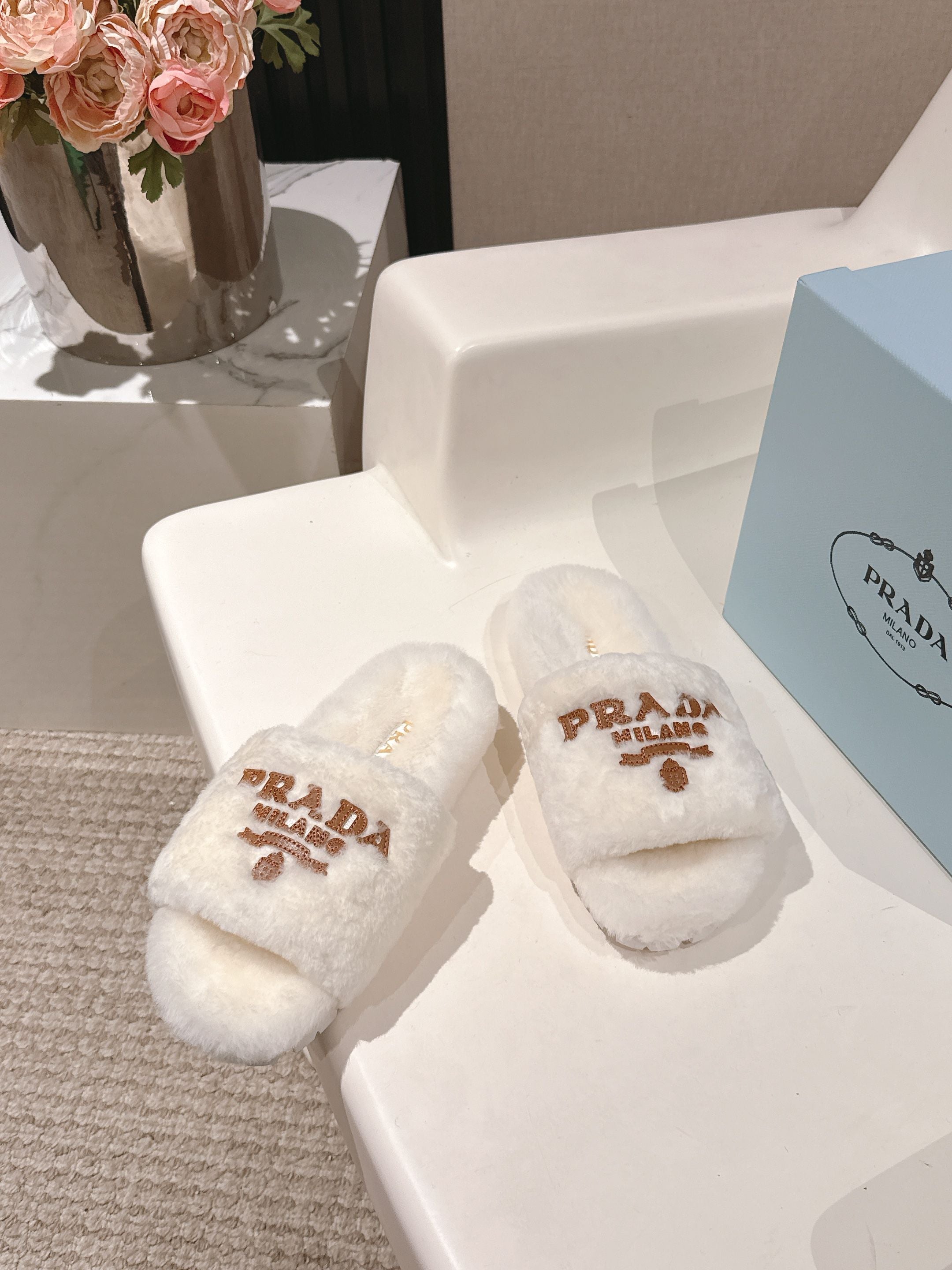 PRADA 25S FLAT MULES IN WHITE RABBIT FUR