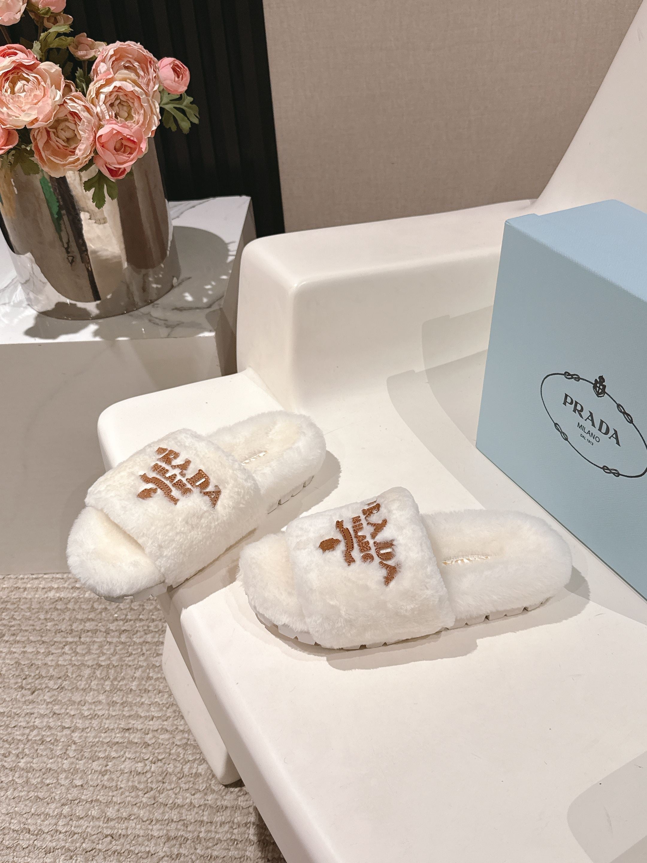 PRADA 25S FLAT MULES IN WHITE RABBIT FUR