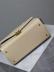 CASSANDRA TOP HANDLE BAG 24 IN BEIGE CALFSKIN GOLD HARDWARE