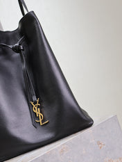 POCHON BUCKET BAG 30 IN BLACK LAMBSKIN GOLD HARDWARE
